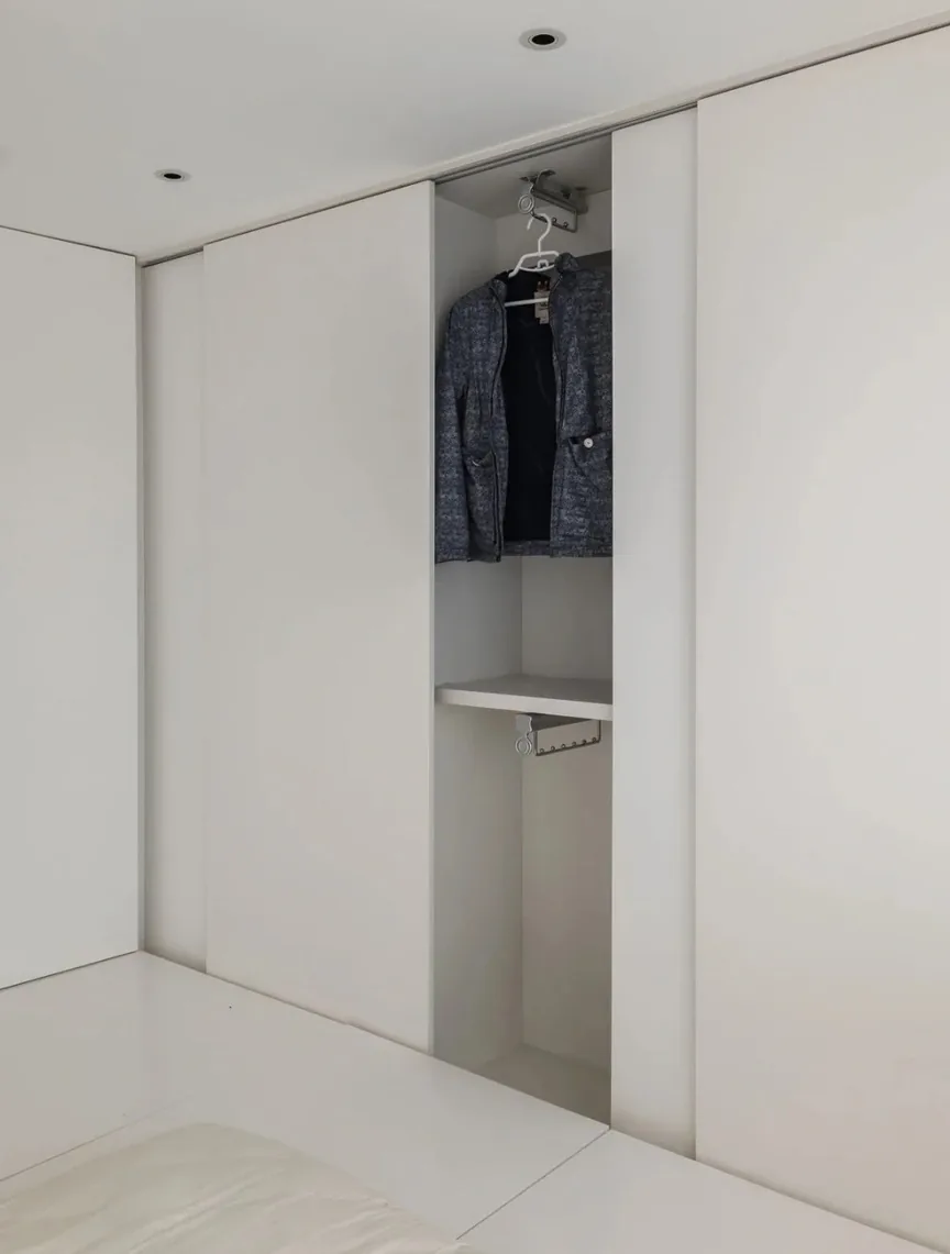 Closet organization system with island and seated dressing area, Hawaii residence
