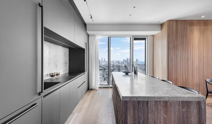 Minimalist kitchen design with porcelain countertops and tall storage walls, Hawaii residence
