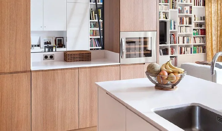Minimalist kitchen design with porcelain countertops and tall storage walls, Hawaii residence