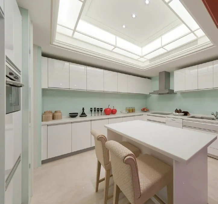 Transitional Hawaii kitchen featuring a marble-look backsplash and integrated dining, Honolulu home