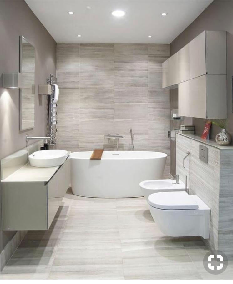 Contemporary bathroom with freestanding tub, wood-look tile wall and floating vanity — O'ahu