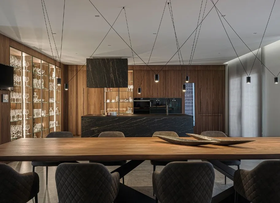 Modern custom kitchen with quartz waterfall island and integrated appliances, Oahu showroom