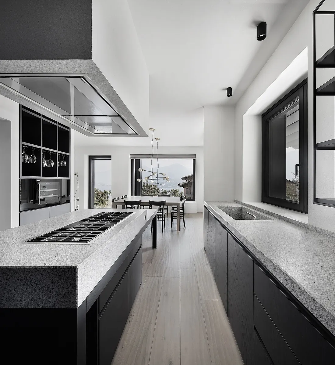 Island kitchen design with breakfast bar seating and pendant lighting, Oahu showroom