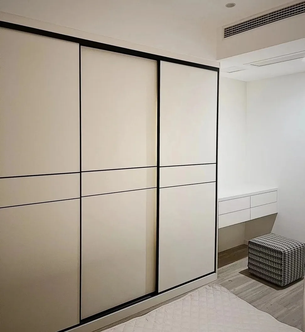 Custom bedroom storage with matte and wood-grain finishes, Kapolei showroom display