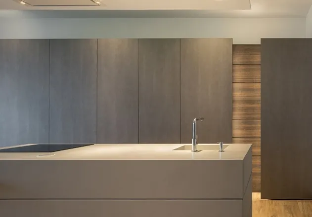 Custom kitchen cabinets featuring walnut accents and soft-close drawers, Oahu custom installation