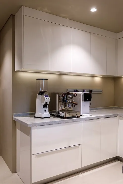 Transitional Hawaii kitchen featuring a marble-look backsplash and integrated dining, Honolulu home