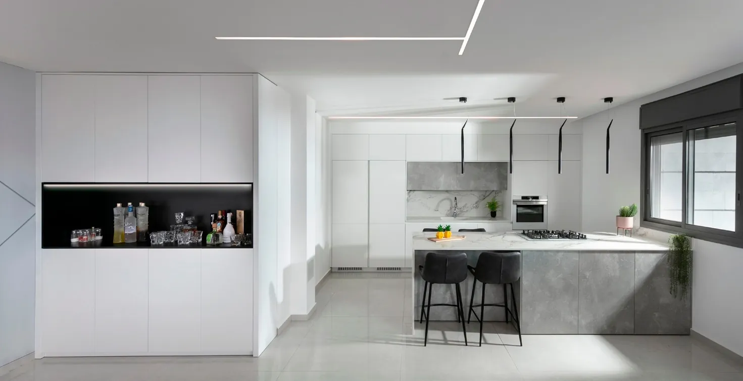 Minimalist kitchen design with porcelain countertops and tall storage walls, Hawaii residence