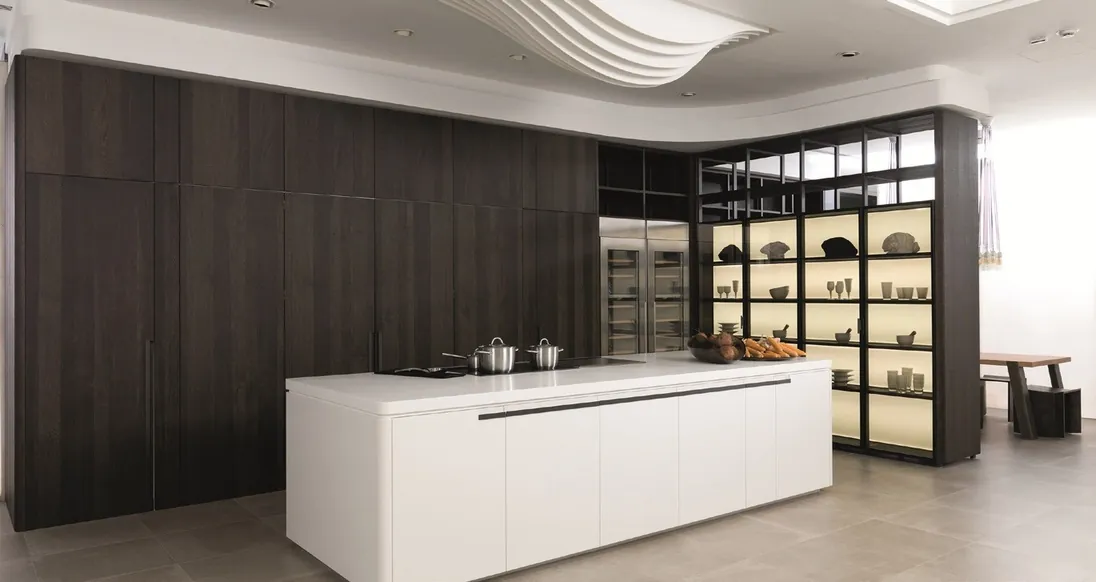 Modern custom kitchen with quartz waterfall island and integrated appliances, Oahu showroom