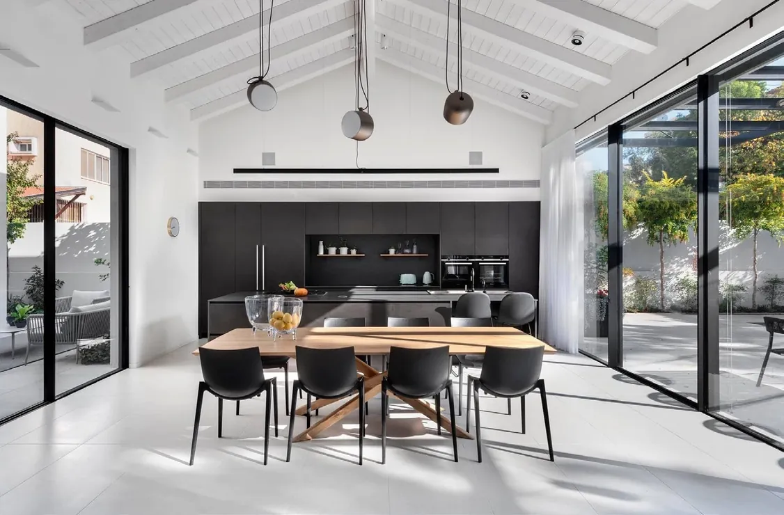 Transitional Hawaii kitchen featuring a marble-look backsplash and integrated dining, Honolulu home