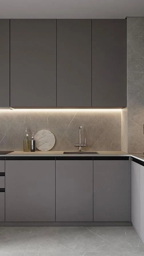 Handleless modern kitchen featuring slab-front cabinetry and under-cabinet LED lighting, Oahu custom installation