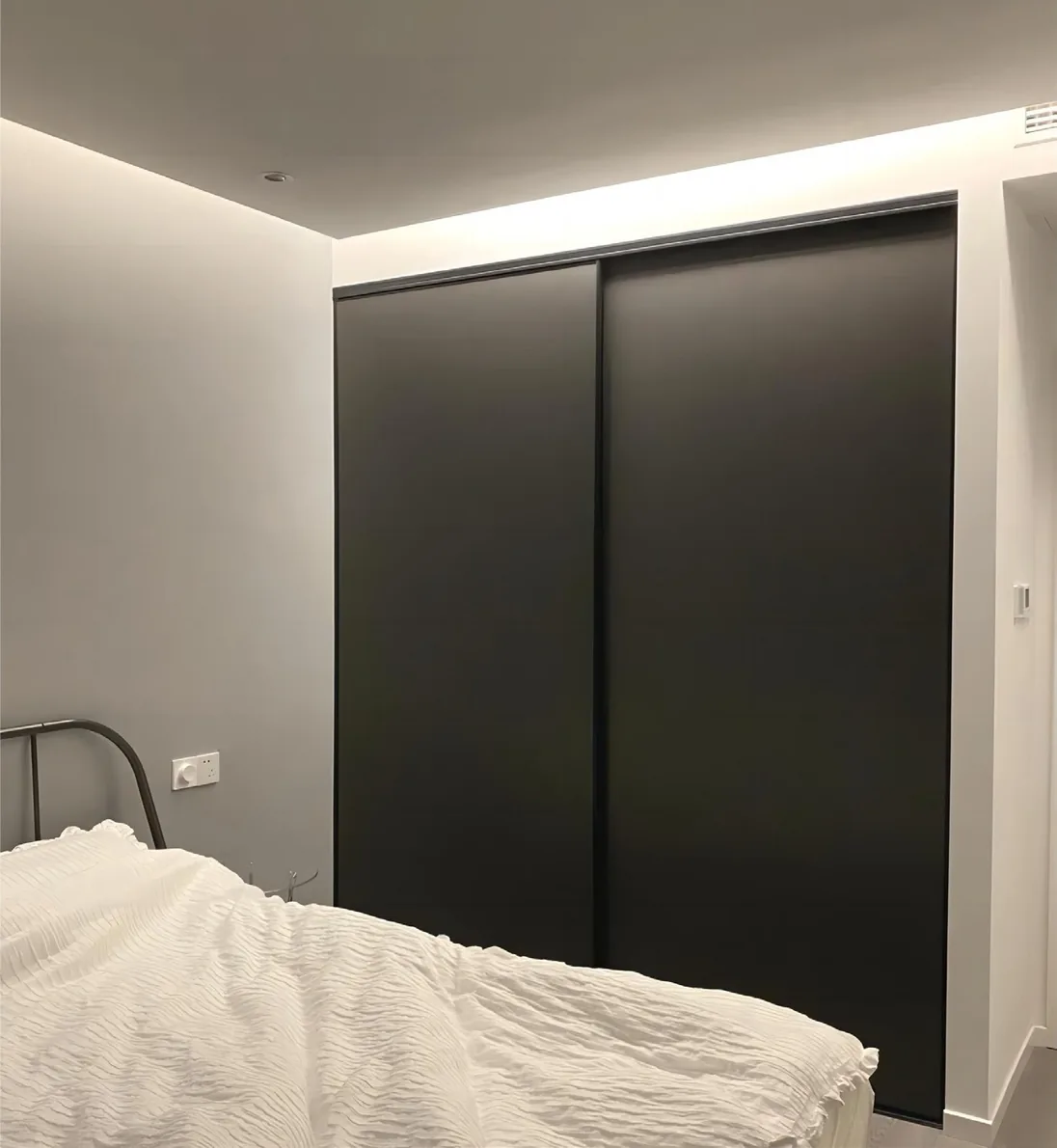 Floor-to-ceiling closet system featuring full-height mirrored doors, Oahu showroom