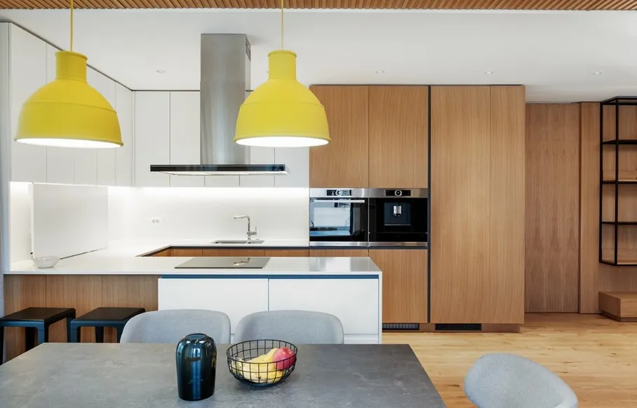 Minimalist kitchen design with porcelain countertops and tall storage walls, Hawaii residence