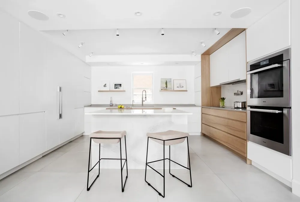Island kitchen design with breakfast bar seating and pendant lighting, Oahu showroom