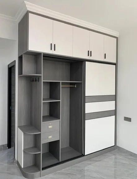 Walk-in dressing room featuring pull-out racks and hampers, Honolulu home