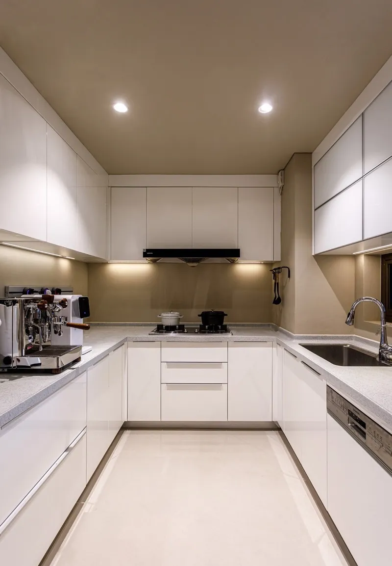Custom kitchen cabinets featuring walnut accents and soft-close drawers, Oahu custom installation