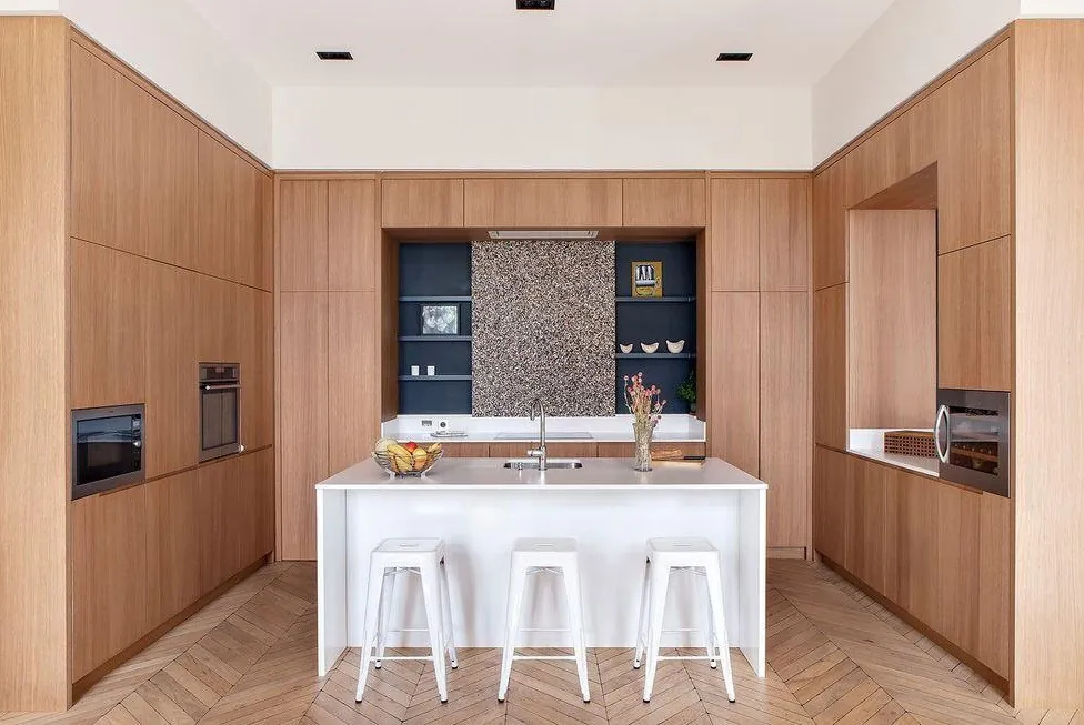 Luxury Oahu kitchen with custom hood, gas cooktop, and prep sink, Honolulu home