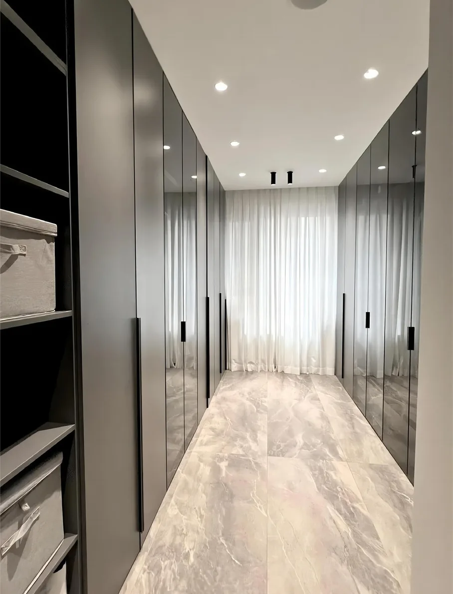 Reach-in wardrobe with glass-front cabinetry, Kapolei showroom display