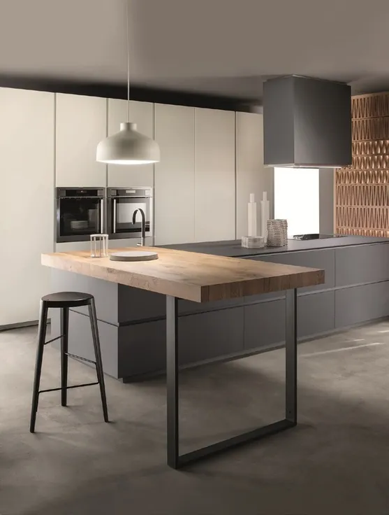 Modern custom kitchen with quartz waterfall island and integrated appliances, Oahu showroom