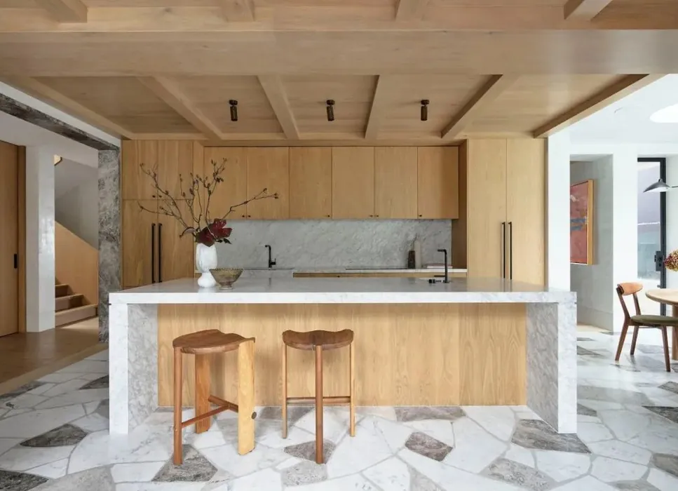 Transitional Hawaii kitchen featuring a marble-look backsplash and integrated dining, Honolulu home
