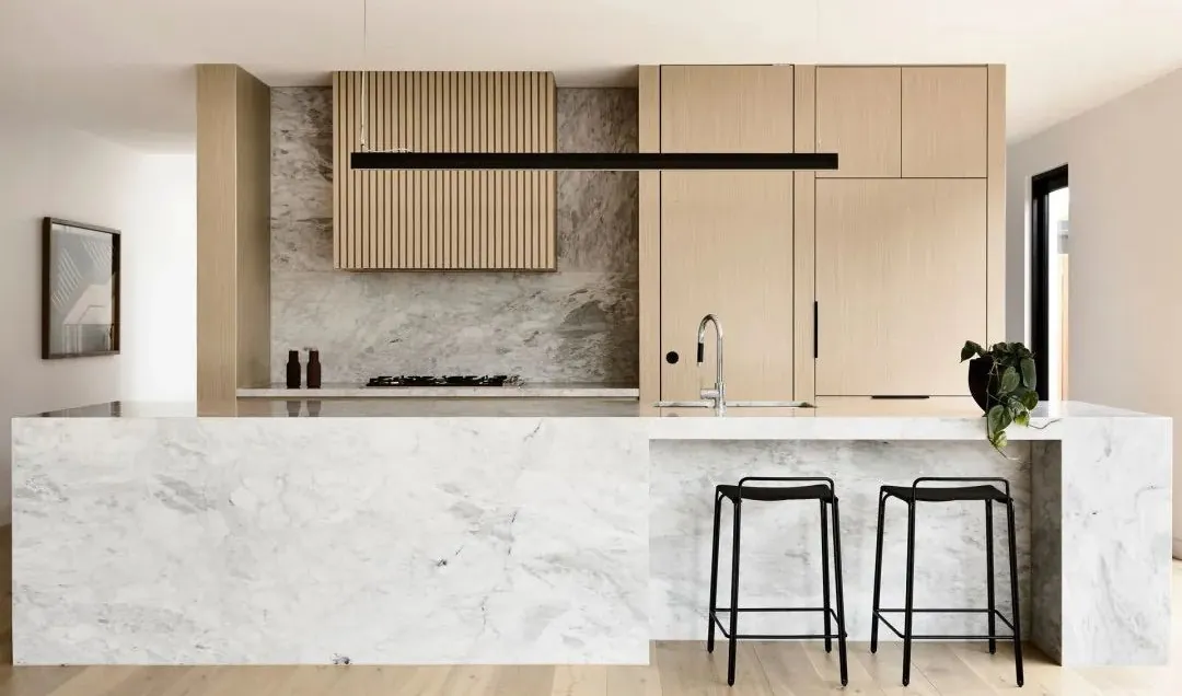 Custom kitchen cabinets featuring walnut accents and soft-close drawers, Oahu custom installation