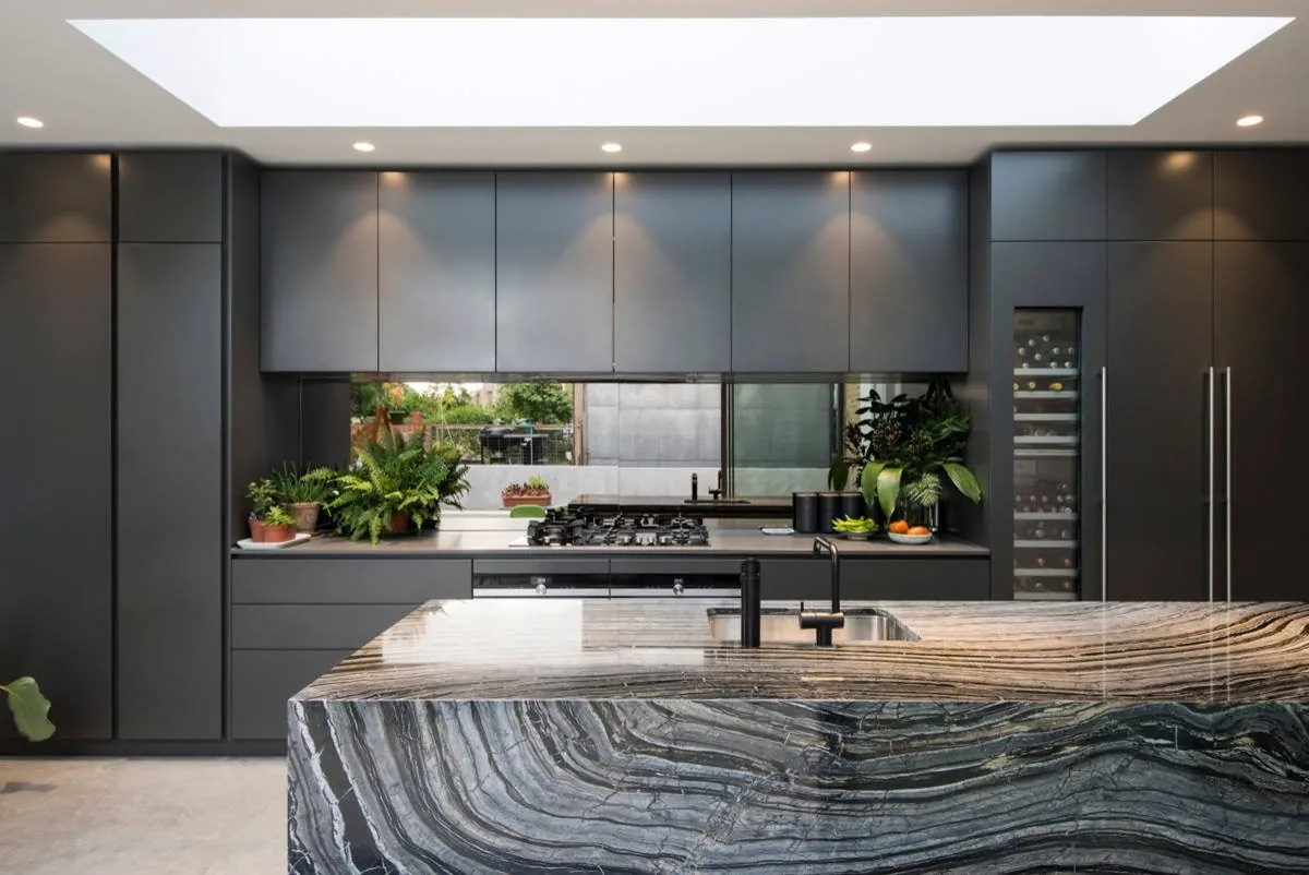 Transitional Hawaii kitchen featuring a marble-look backsplash and integrated dining, Honolulu home