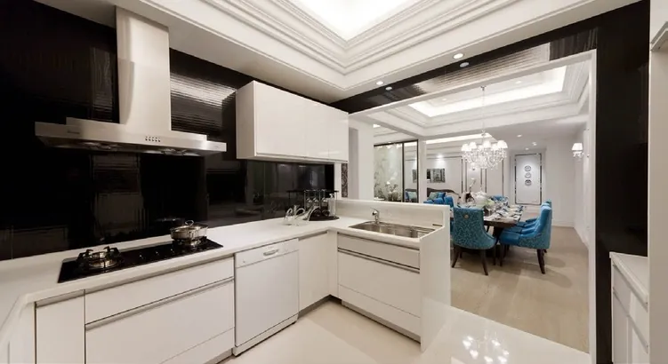 Modern custom kitchen with quartz waterfall island and integrated appliances, Oahu showroom